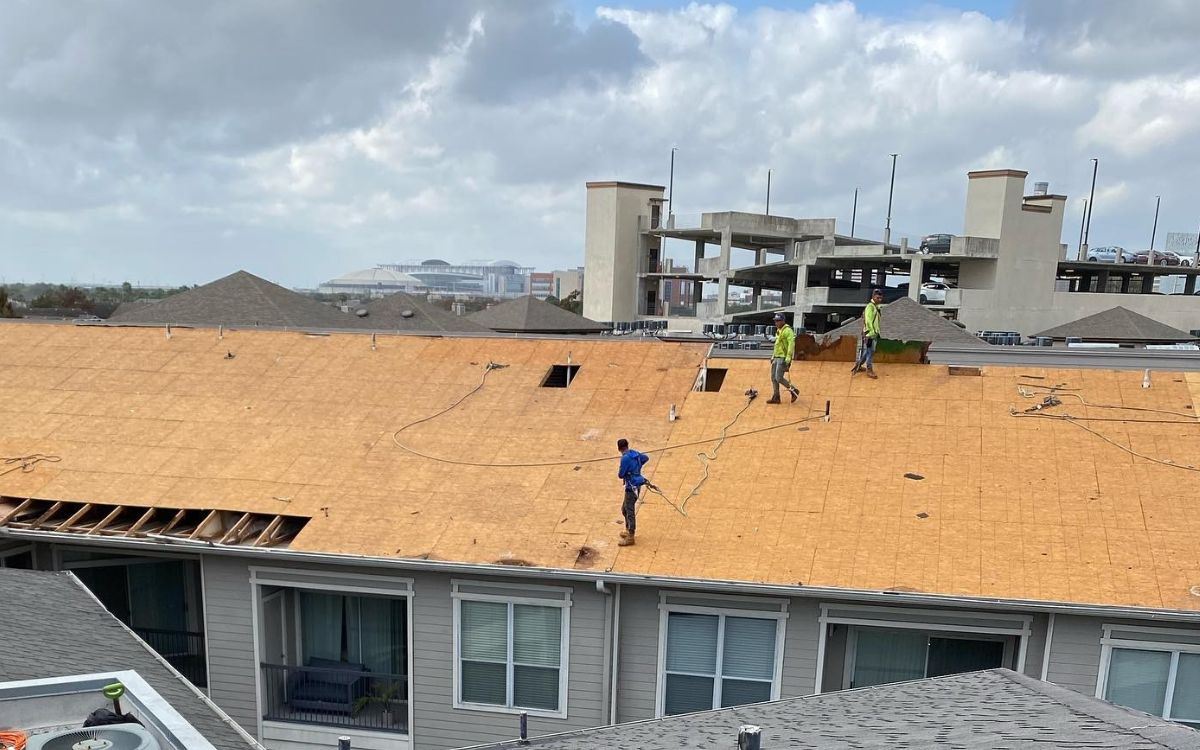 Roof decking work on a multifamily building