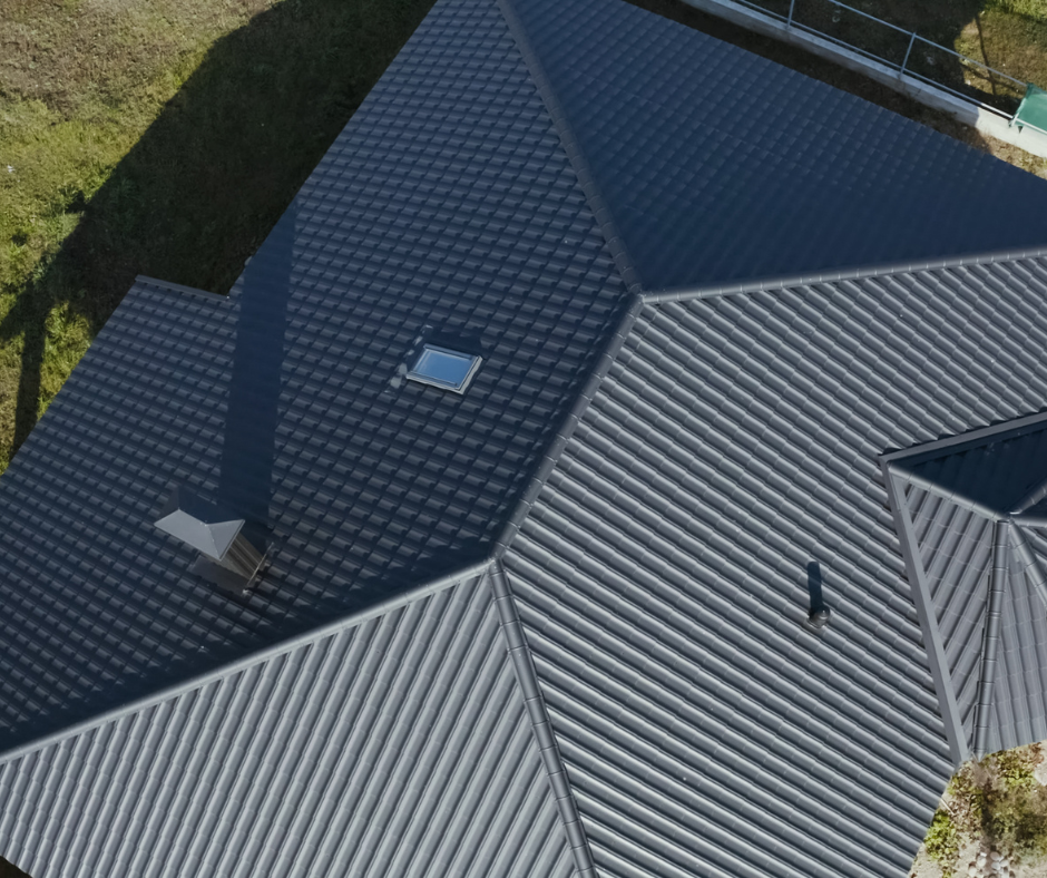 Completed residential metal roofing system with clean trim and flashing
