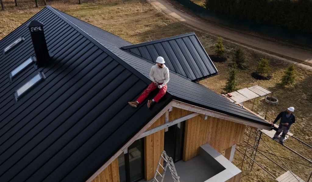 Standing-seam metal roof installation showing roof planes and ridge details